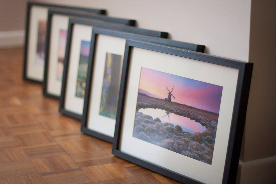 Framed prints by Justin Minns ready for an exhibition in Colchester, Essex